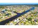Residential neighborhood featuring waterfront properties along a canal and beautiful tree coverage at 7094 Kenwood Dr, North Port, FL 34287