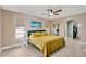 Comfortable bedroom with a ceiling fan and an archway that leads to a walk-in closet at 7094 Kenwood Dr, North Port, FL 34287