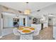 Open dining area featuring stylish furnishings and a view of the living room and kitchen at 7094 Kenwood Dr, North Port, FL 34287