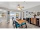 Dining area with views of the outdoor water, seamlessly connecting to the living room at 7094 Kenwood Dr, North Port, FL 34287