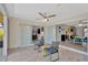 Open-concept layout with a sunroom with comfortable seating and water views at 7094 Kenwood Dr, North Port, FL 34287