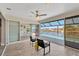 Enclosed lanai offers a tranquil space with comfortable seating and scenic water views at 7094 Kenwood Dr, North Port, FL 34287