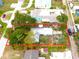 Bird's-eye view of a residential property marked with a red boundary, indicating its layout and surroundings at 714 Gray S St, Gulfport, FL 33707