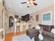 Stylish living room featuring hardwood floors, a breakfast bar and an open concept design at 7311 S Kissimmee St, Tampa, FL 33616