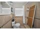 Bathroom with tiled shower and toilet at 805 Bruce Ave, Clearwater Beach, FL 33767
