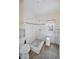 Modest bathroom with shower and door to outside; in need of remodeling at 805 Bruce Ave, Clearwater Beach, FL 33767