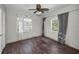 Bedroom with hardwood floors, natural lighting, and decorative curtains at 805 Bruce Ave, Clearwater Beach, FL 33767