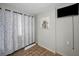 Bedroom featuring light floral curtains and modern artistic decor at 805 Bruce Ave, Clearwater Beach, FL 33767