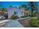 Side exterior showcasing the home's architecture, landscape and walkway on a sunny day at 805 Bruce Ave, Clearwater Beach, FL 33767