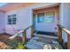Front porch features a small wooden ramp, a covered entrance and nearby window at 805 Bruce Ave, Clearwater Beach, FL 33767