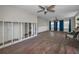Living room featuring exposed frame, hardwood flooring, with natural light filtering through the windows at 805 Bruce Ave, Clearwater Beach, FL 33767