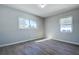 Sunlit bedroom with gray walls and vinyl flooring at 813 Helena Dr, Largo, FL 33770