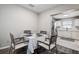 Cozy dining area with a modern table setting adjacent to the kitchen at 813 Helena Dr, Largo, FL 33770