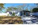 Charming single-story home featuring a freshly painted exterior and well-maintained landscaping at 813 Helena Dr, Largo, FL 33770