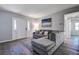 Inviting living room with a comfortable sectional sofa, stylish rug, and neutral decor at 813 Helena Dr, Largo, FL 33770