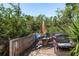 Backyard outdoor deck with river views and outdoor grill, perfect for gatherings at 8423 Jackson Springs Rd, Tampa, FL 33615