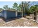 Charming backyard with exterior access and wooden fence at 8423 Jackson Springs Rd, Tampa, FL 33615