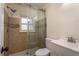 Tiled bathroom with a glass shower and modern fixtures at 8423 Jackson Springs Rd, Tampa, FL 33615