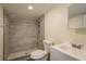 Modern bathroom with tiled shower and updated vanity at 8423 Jackson Springs Rd, Tampa, FL 33615