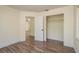 Bedroom featuring wood floors, closet and entry doorway at 8423 Jackson Springs Rd, Tampa, FL 33615