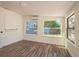 Bright bedroom with multiple windows and new floors at 8423 Jackson Springs Rd, Tampa, FL 33615