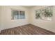 Bright bedroom with wood floors and large windows at 8423 Jackson Springs Rd, Tampa, FL 33615