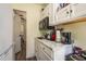 Kitchen with stainless steel microwave and marble countertops at 8423 Jackson Springs Rd, Tampa, FL 33615