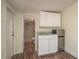 Functional kitchenette with sink, cabinets, and a mini-fridge at 8423 Jackson Springs Rd, Tampa, FL 33615
