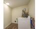 Functional laundry room with modern washing machine and utility connections for convenience at 8423 Jackson Springs Rd, Tampa, FL 33615