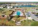 Aerial view of a community pool with lounge chairs and a building for residents at 8609 Winning Fields Rd, New Port Richey, FL 34655