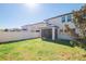 A backyard with a screened-in porch, green grass and a privacy fence at 8609 Winning Fields Rd, New Port Richey, FL 34655