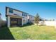 A backyard with a screened-in porch, green grass and a privacy fence at 8609 Winning Fields Rd, New Port Richey, FL 34655