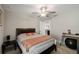 Cozy bedroom features neutral colored walls, a ceiling fan and carpet at 8609 Winning Fields Rd, New Port Richey, FL 34655