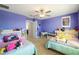 Shared ' bedroom with two beds, desk and a ceiling fan at 8609 Winning Fields Rd, New Port Richey, FL 34655