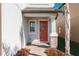 Inviting front entrance with a decorative wreath, brick accents, and a covered porch at 8609 Winning Fields Rd, New Port Richey, FL 34655