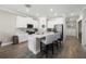 Spacious kitchen with a central island, white cabinetry, and modern appliances at 8609 Winning Fields Rd, New Port Richey, FL 34655