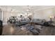 Open-concept living area with a view of the modern kitchen and dining space at 8609 Winning Fields Rd, New Port Richey, FL 34655