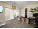 Bright home office featuring hardwood flooring and built-in desk with storage at 8609 Winning Fields Rd, New Port Richey, FL 34655