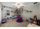 Bright and inviting playroom with ample storage shelves and playful decor, perfect for children at 8609 Winning Fields Rd, New Port Richey, FL 34655