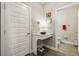 Stylish powder room with modern sink, vanity, and tiled flooring at 8609 Winning Fields Rd, New Port Richey, FL 34655