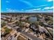Scenic aerial view of homes surrounding a peaceful lake at 1032 Jambalana Dr, Holiday, FL 34691