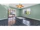 Bright living area with a sliding door leading to a screened-in patio at 1032 Jambalana Dr, Holiday, FL 34691