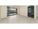 Bright living area with tile flooring, a large sliding glass door, and views of the outdoor space and backyard at 1032 Jambalana Dr, Holiday, FL 34691