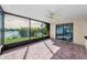 Screened patio offers picturesque waterfront views, combining indoor comfort with outdoor scenery at 1032 Jambalana Dr, Holiday, FL 34691