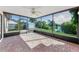 Screened patio with waterfront view, connecting indoor space with a relaxing outdoor retreat at 1032 Jambalana Dr, Holiday, FL 34691
