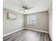 Comfortable bedroom with ceiling fan, new floors and plenty of natural light at 106 Meadow Ln # 106, Oldsmar, FL 34677