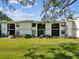 Well-maintained condo community with manicured lawns and mature trees at 106 Meadow Ln # 106, Oldsmar, FL 34677