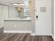 This light and bright kitchen area has light colored cabinets, bar seating, and is adjacent to the living room at 106 Meadow Ln # 106, Oldsmar, FL 34677