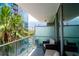 Cozy balcony with seating offering views of the city skyline and surrounding trees at 111 N 12Th St # 1426, Tampa, FL 33602