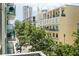 Picturesque balcony view of the city with surrounding buildings and lush green trees at 111 N 12Th St # 1426, Tampa, FL 33602